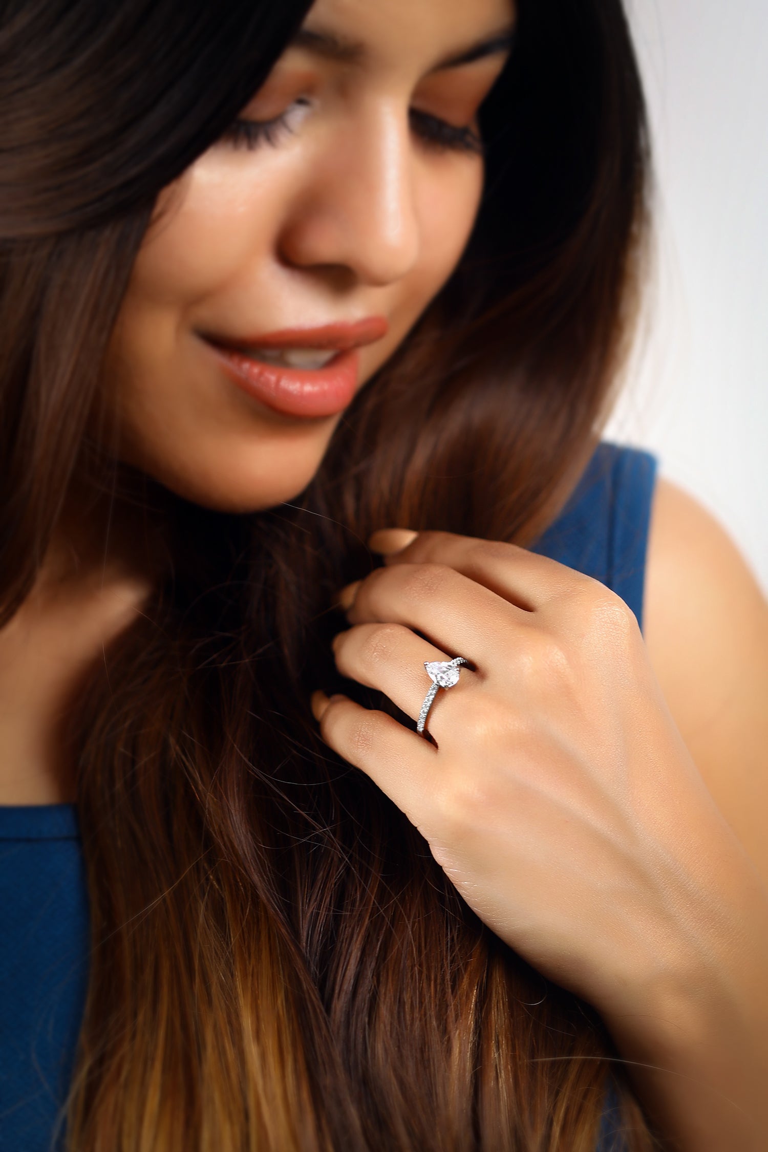 Dulce Pear Solitaire Ring on a Pavé Ring