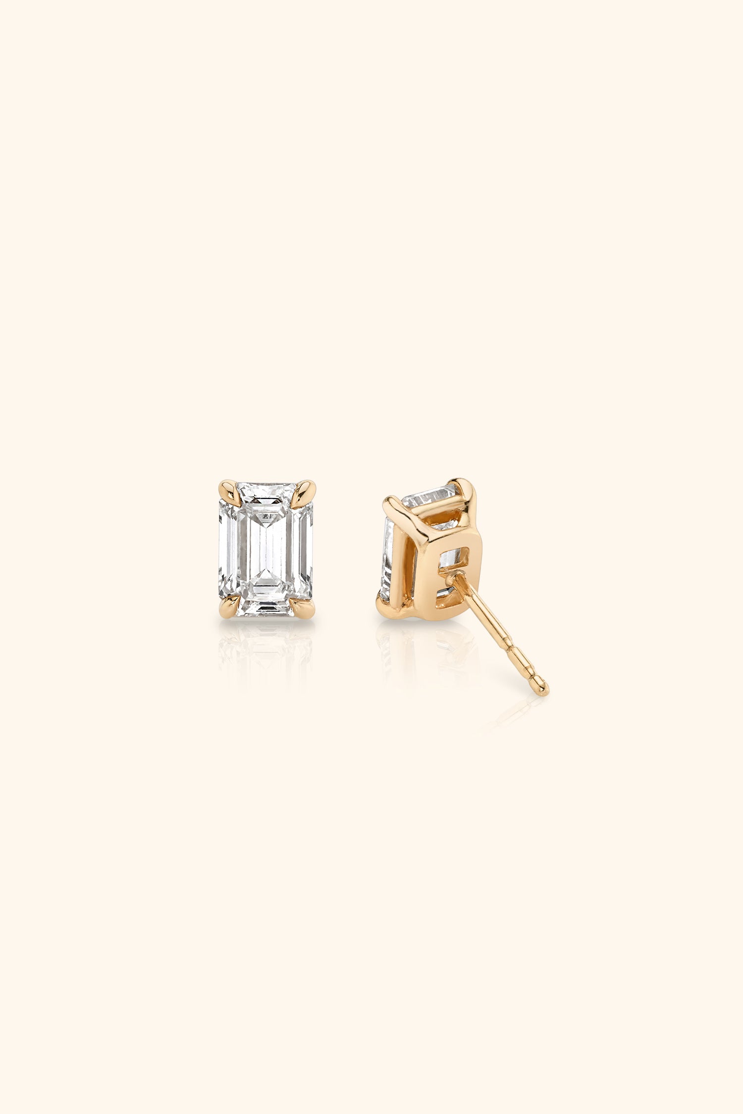 Classic Diamond Studs set with an Emerald Solitaire