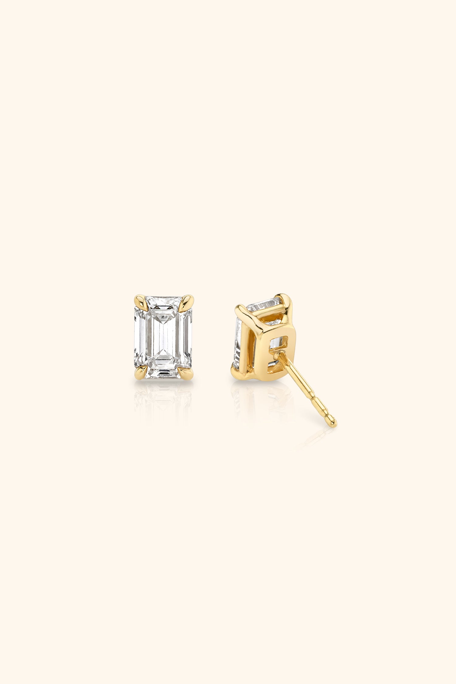 Classic Diamond Studs set with an Emerald Solitaire