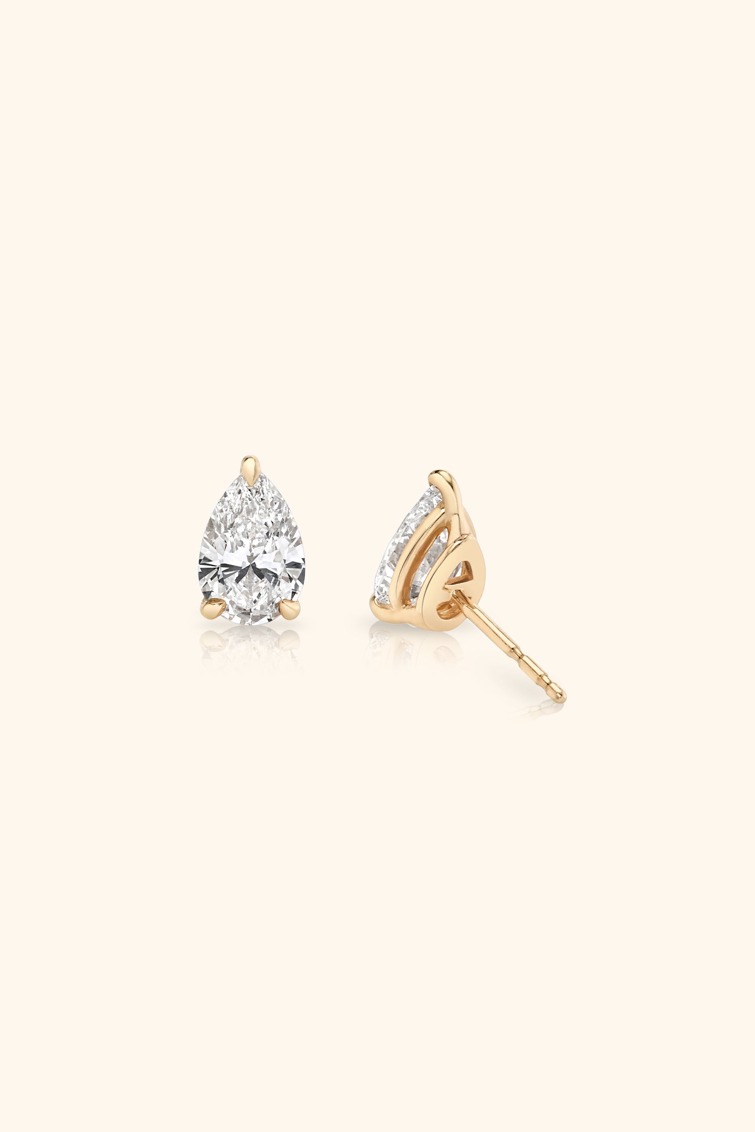 Classic Diamond Studs set with Pear Solitaire