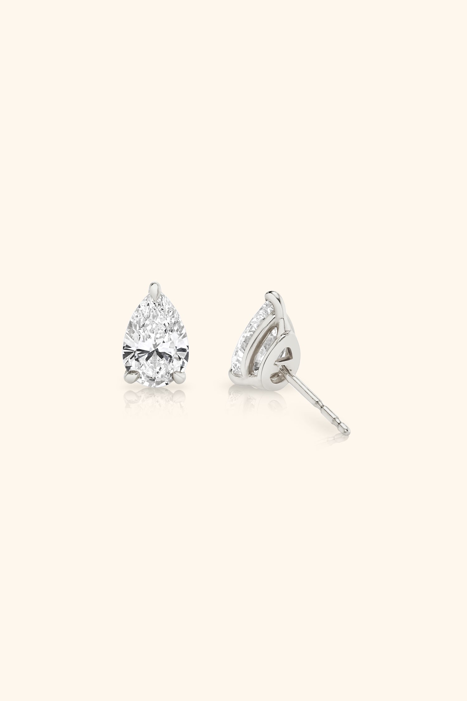 Classic Diamond Studs set with Pear Solitaire