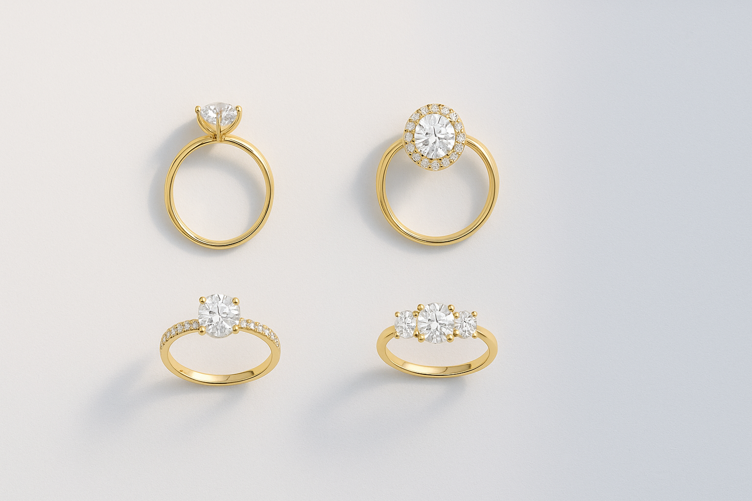 Several lab grown diamond engagement rings showing different setting styles such as solitaire, halo and pave in warm gold.