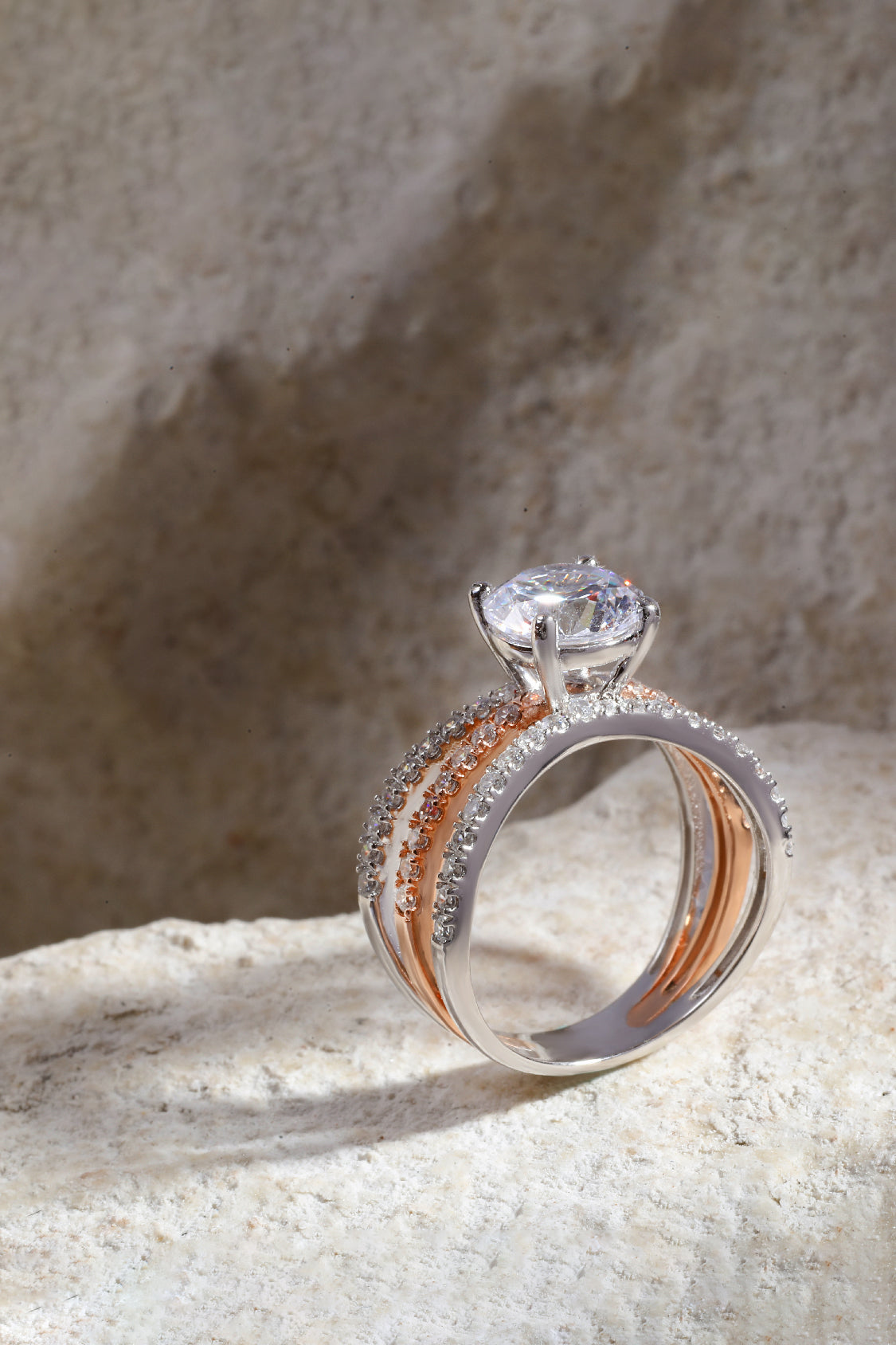 Estrella Triple Pave Ring with a Round Solitaire
