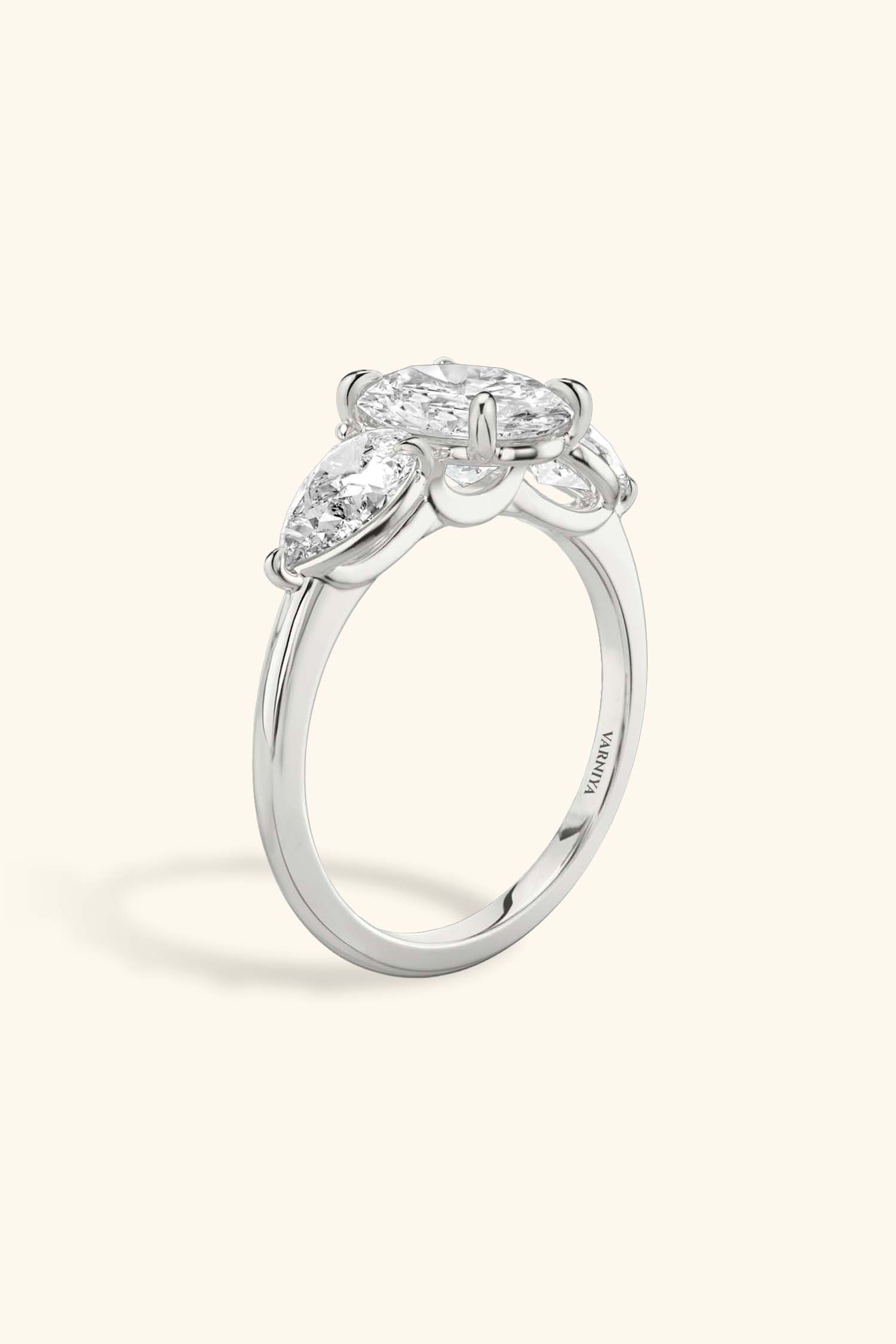 Trilogy Grace with Oval Solitaire Ring with 1/2 Carat Pear Side Stones