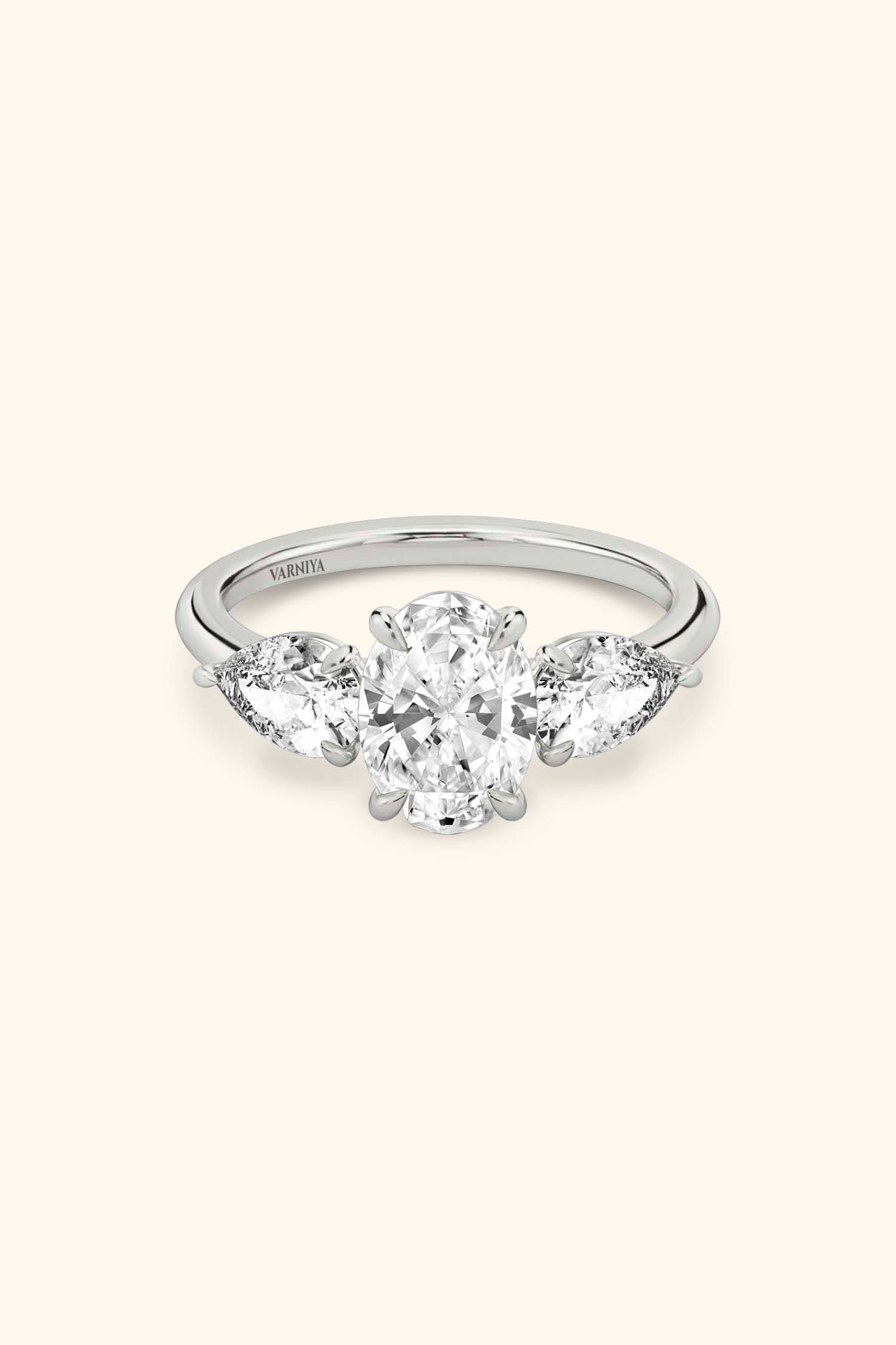 Trilogy Grace with Oval Solitaire Ring with 1/2 Carat Pear Side Stones