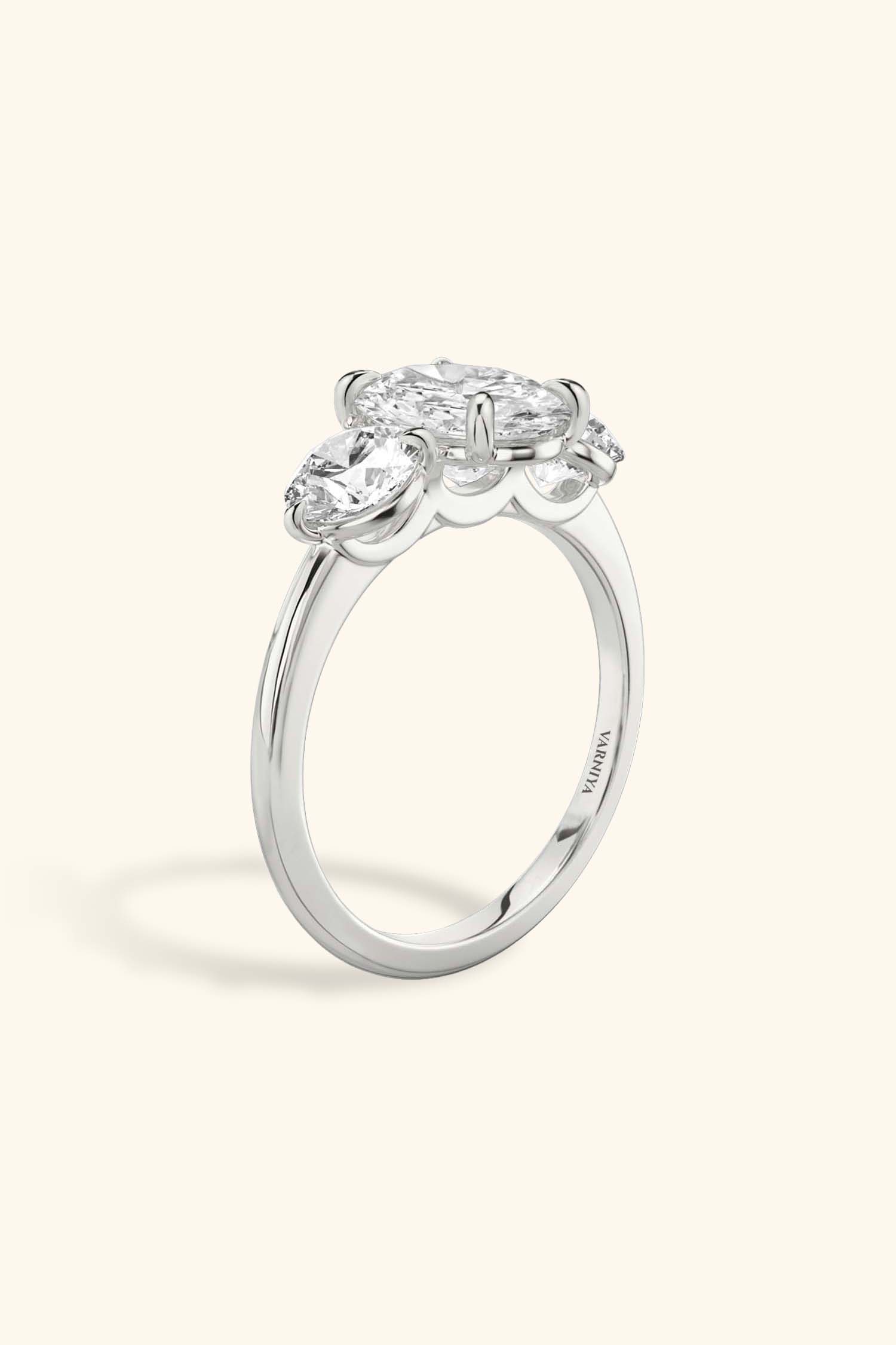 Trilogy Grace with Oval Solitaire Ring with 1/2 Carat Round Side Stones