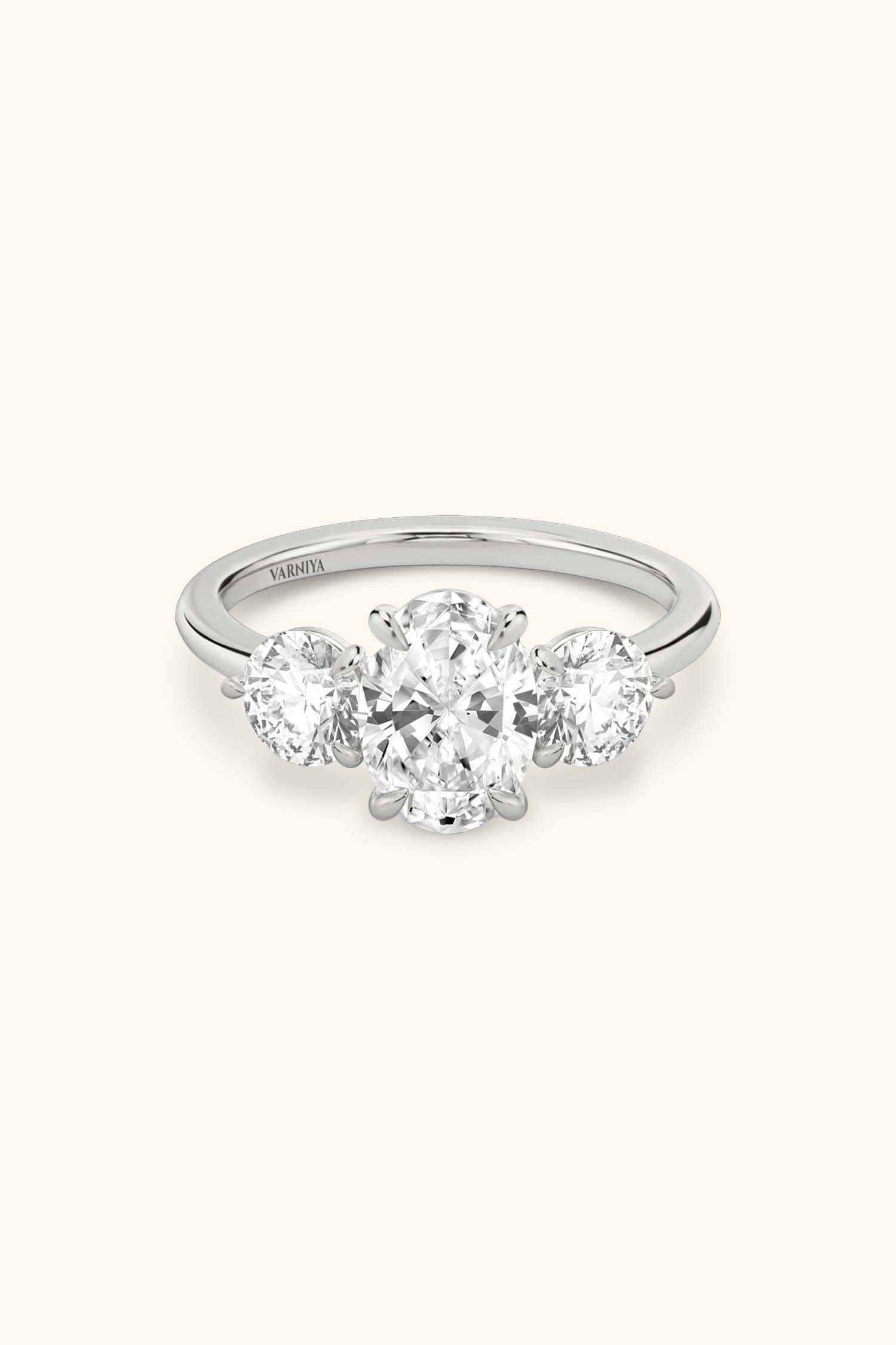 Trilogy Grace with Oval Solitaire Ring with 1/2 Carat Round Side Stones