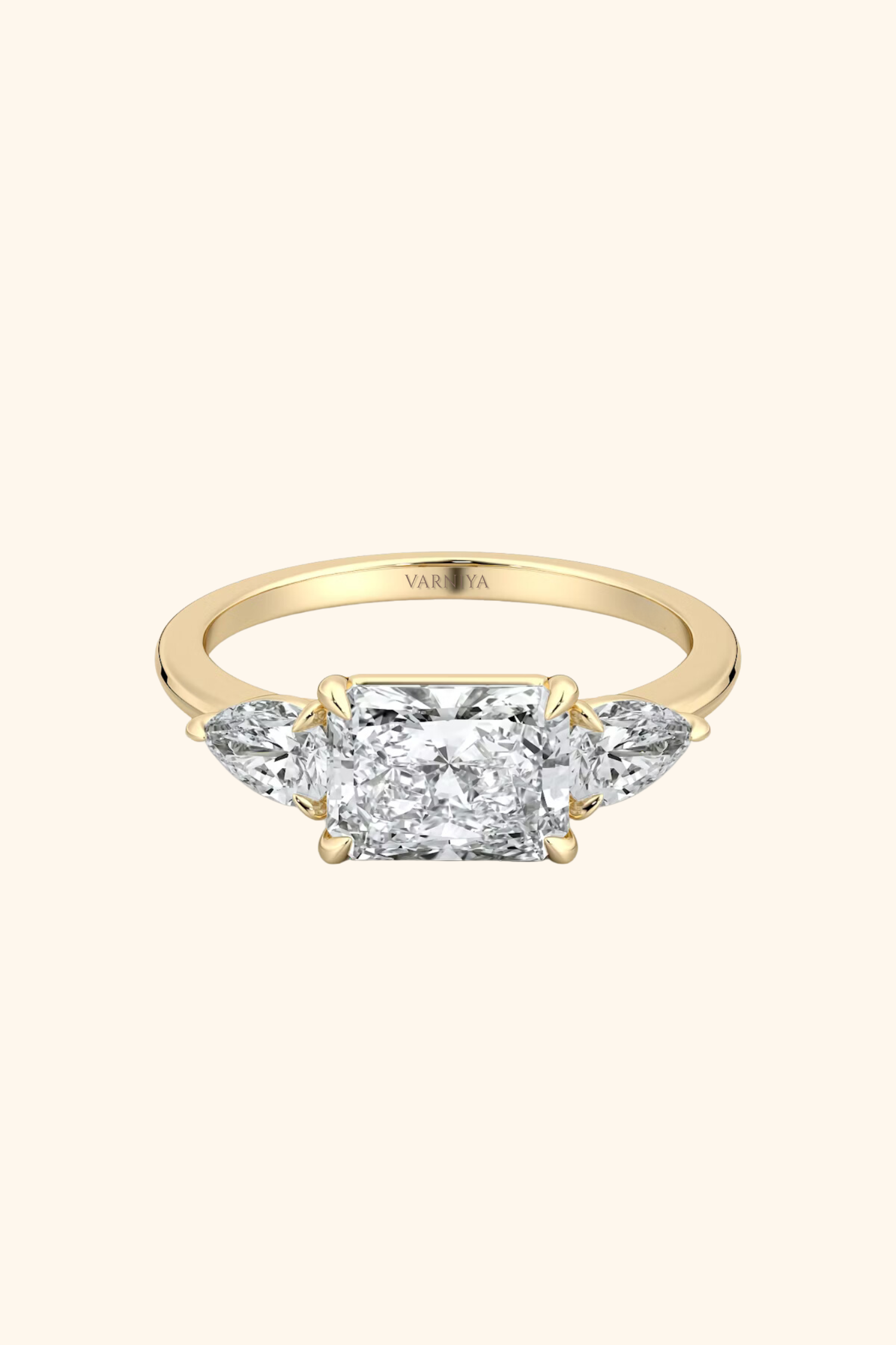 East West Radiant Solitaire Ring with Pear Side Stones