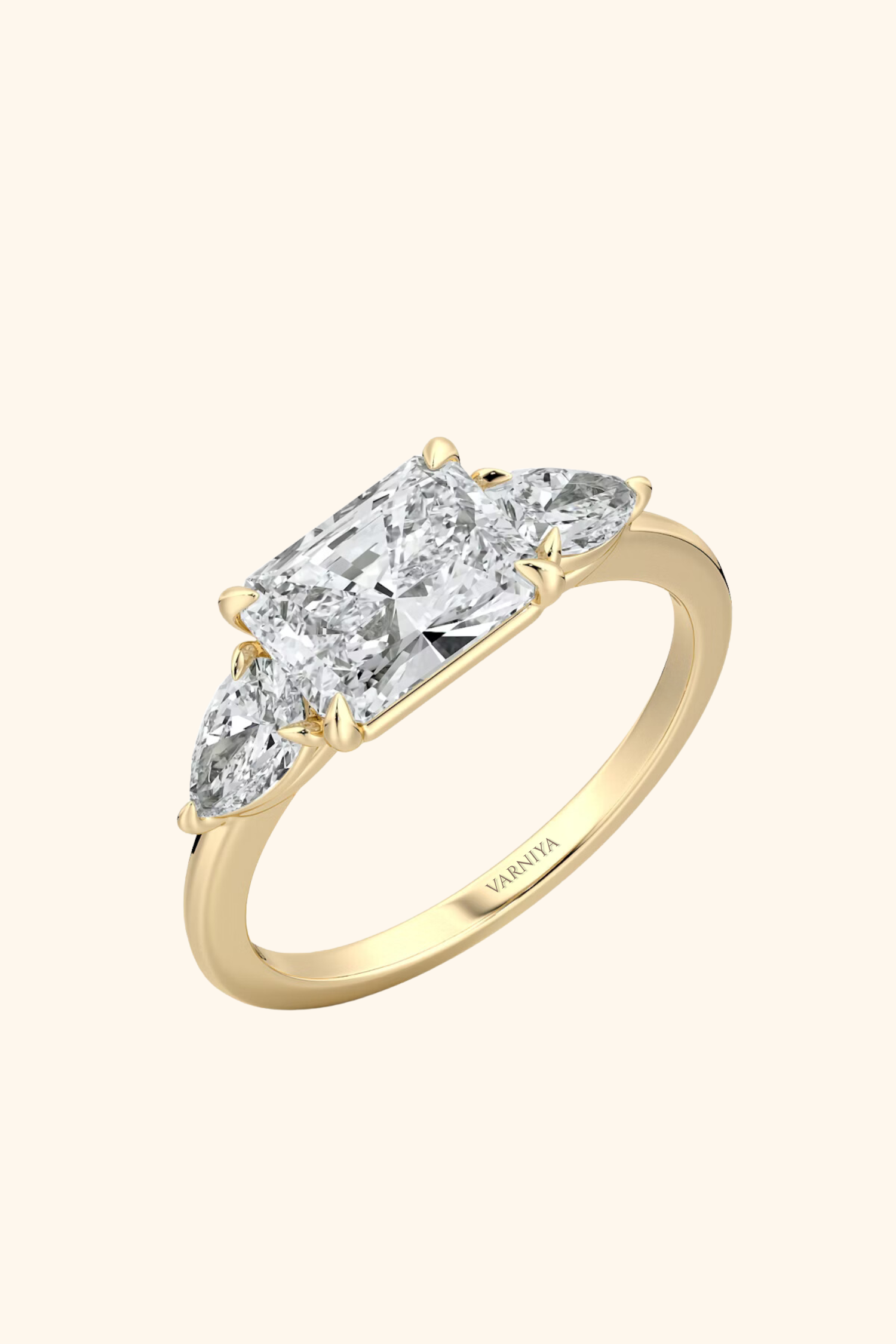 East West Radiant Solitaire Ring with Pear Side Stones