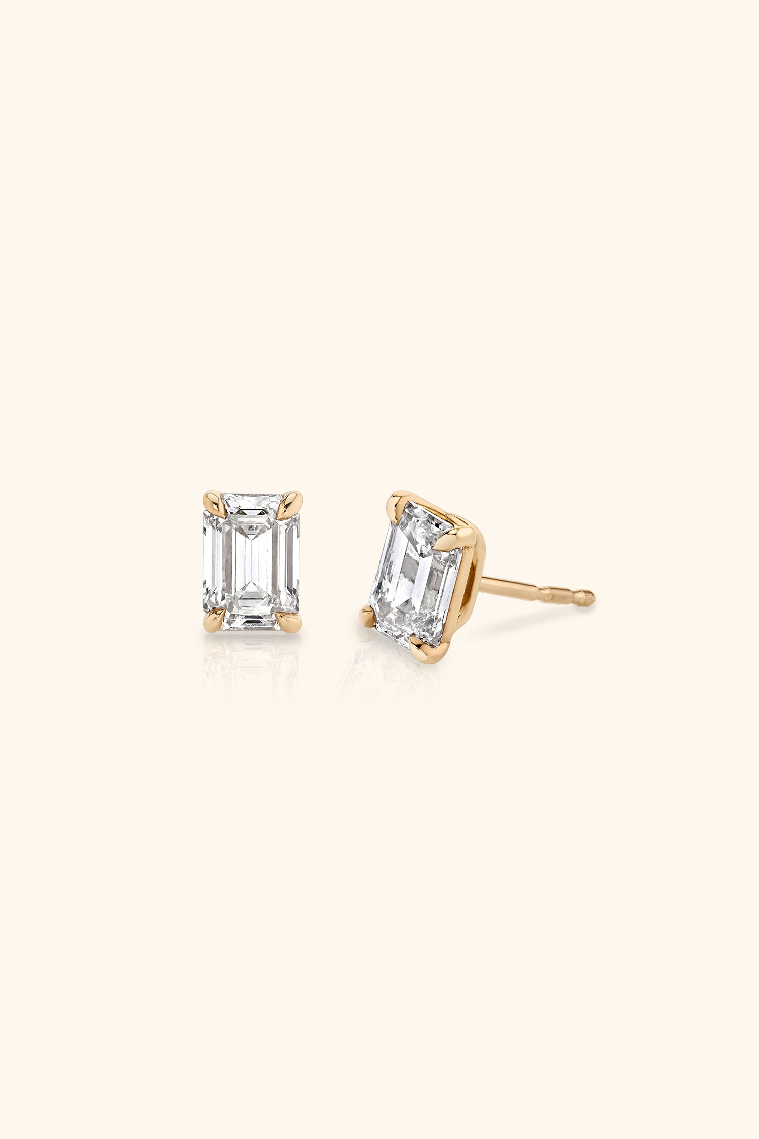 Classic Diamond Studs with an Emerald Solitaire