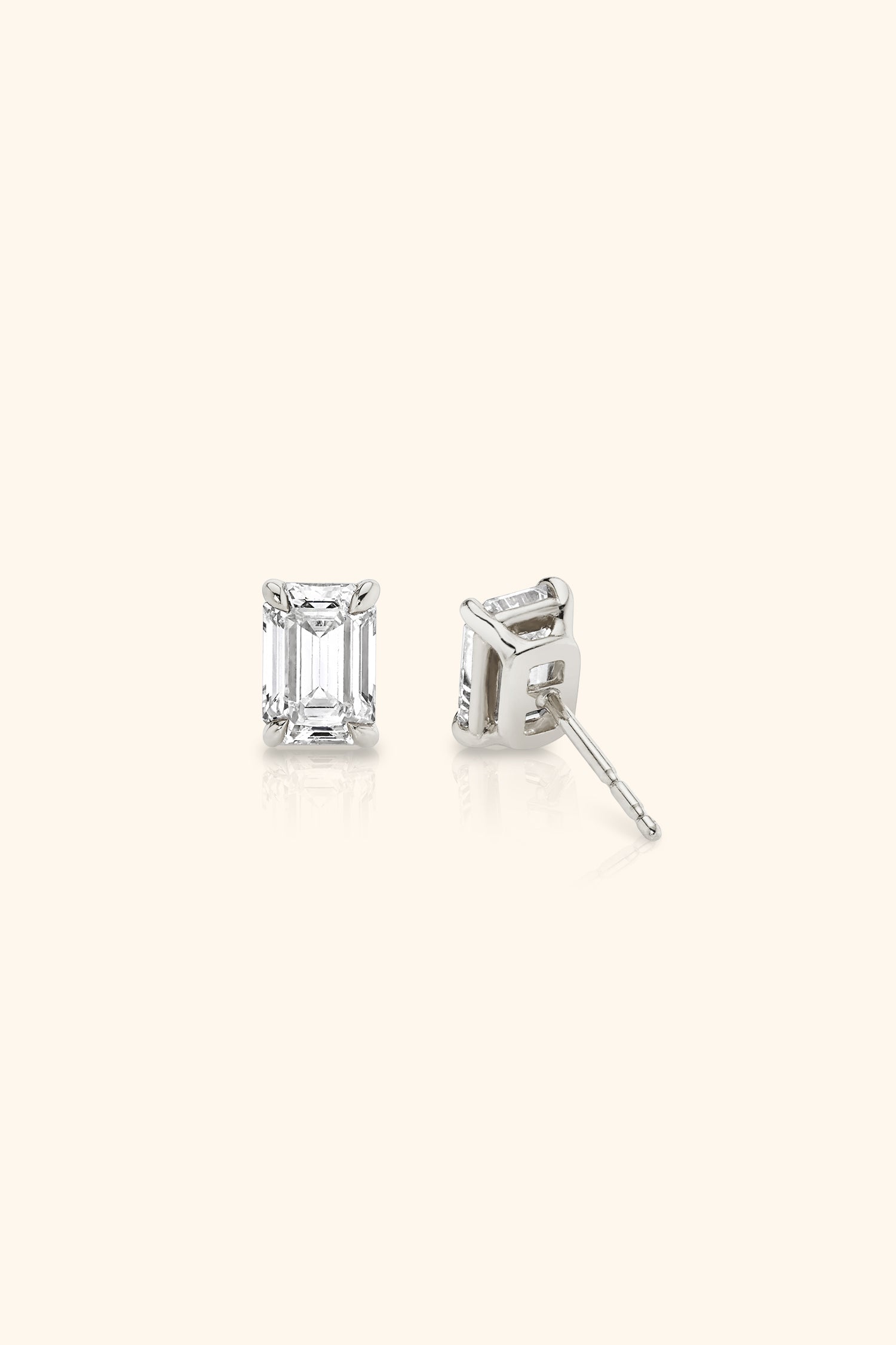 Classic Diamond Studs set with an Emerald Solitaire