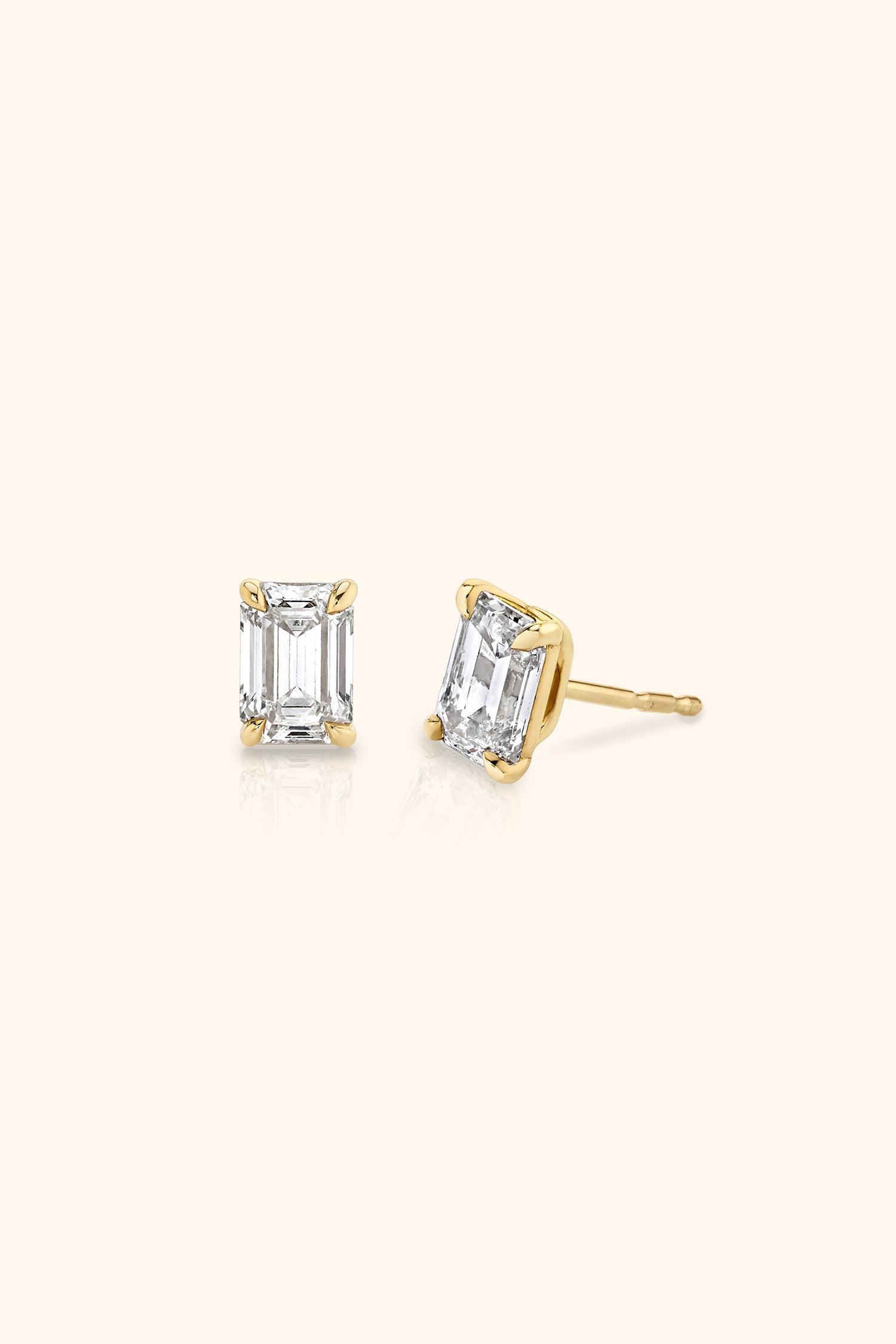 Classic Diamond Studs set with an Emerald Solitaire