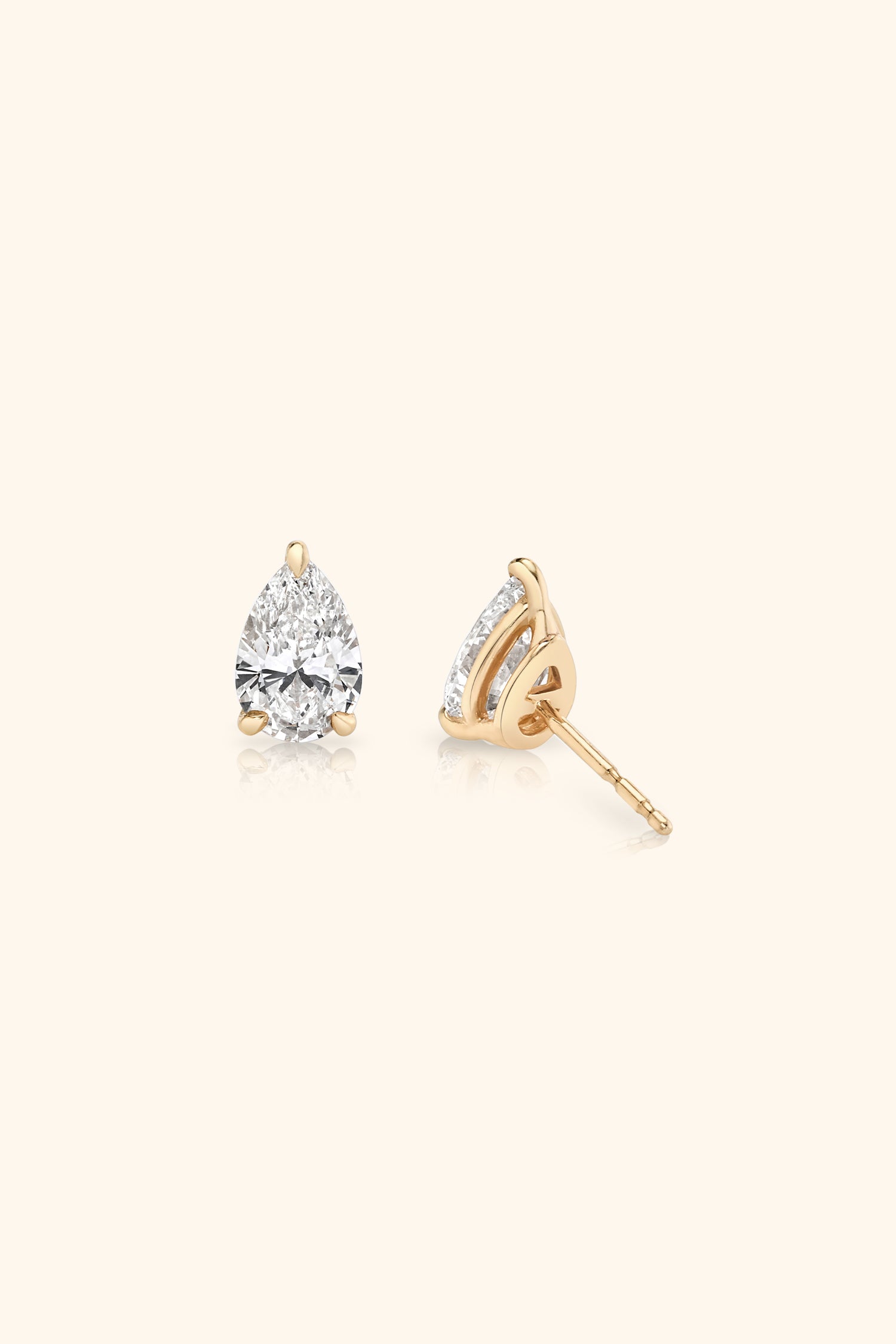 Classic Diamond Studs set with Pear Solitaire