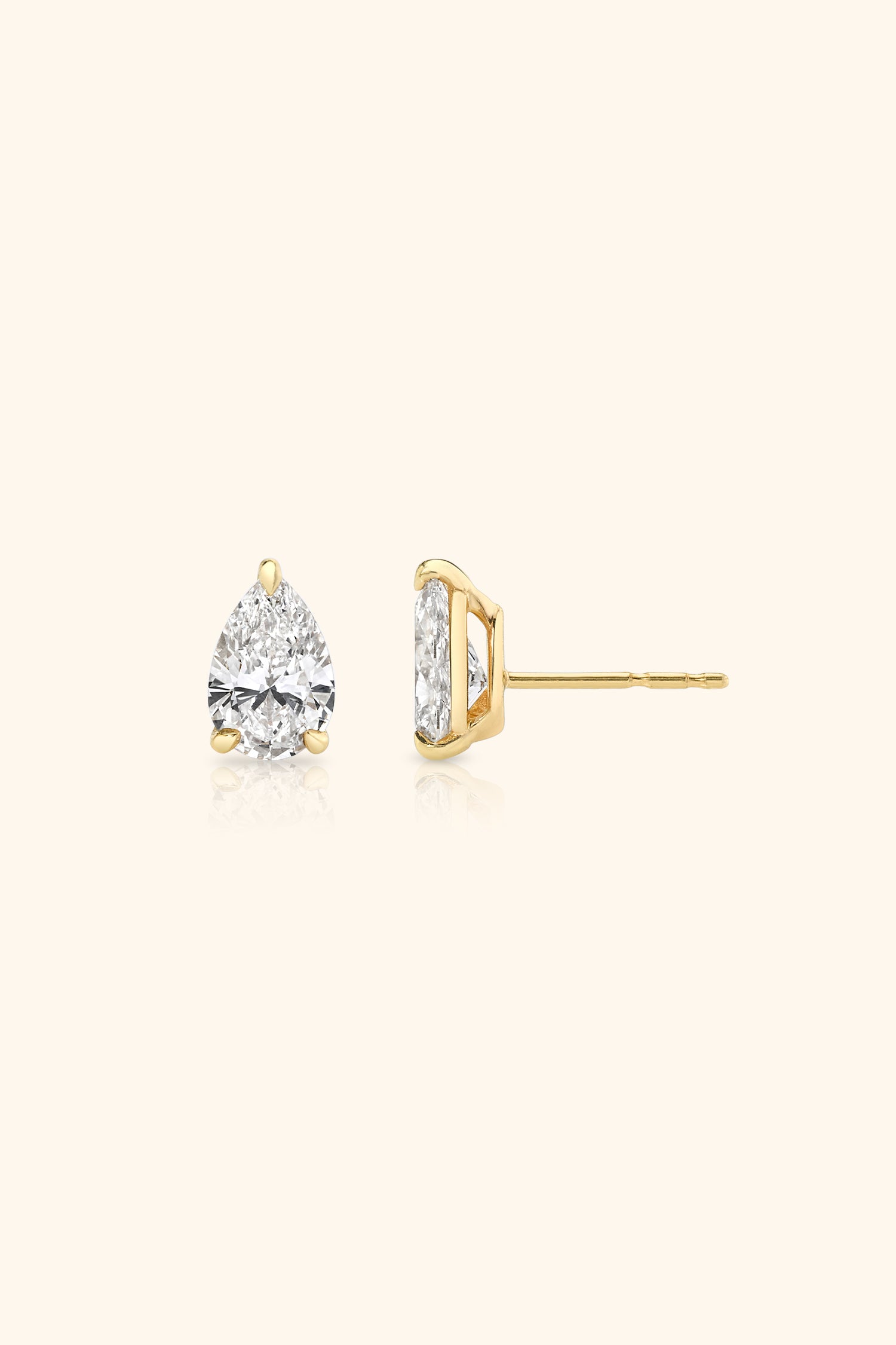 Classic Diamond Studds set with Pear Solitaire