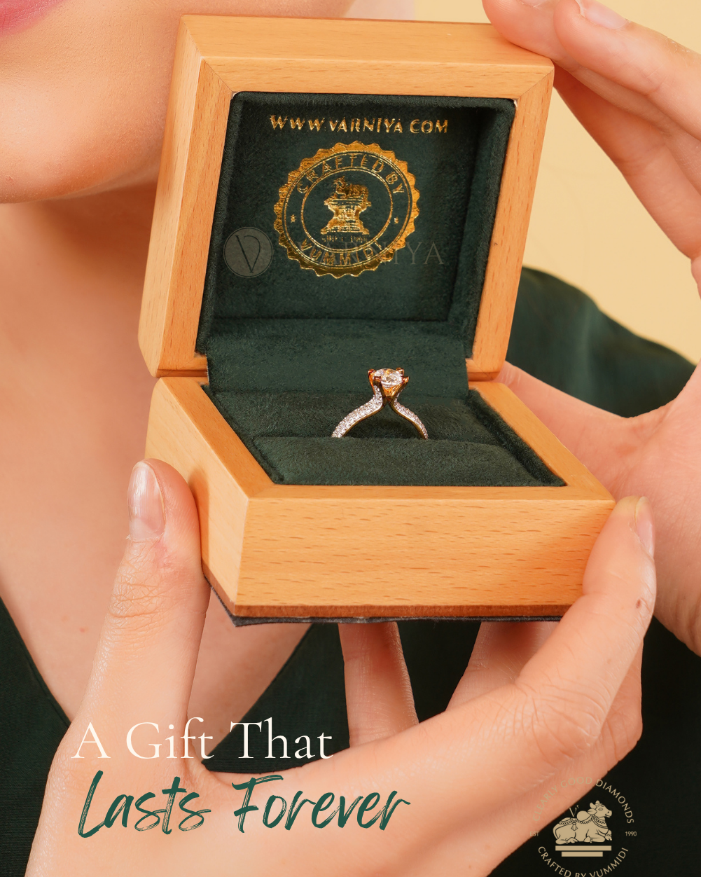 A close-up lifestyle shot of a person holding an open wooden ring box with a gold-engraved interior and a ring inside. The person is cropped on the left, showing a smile, and the background is a solid warm beige.