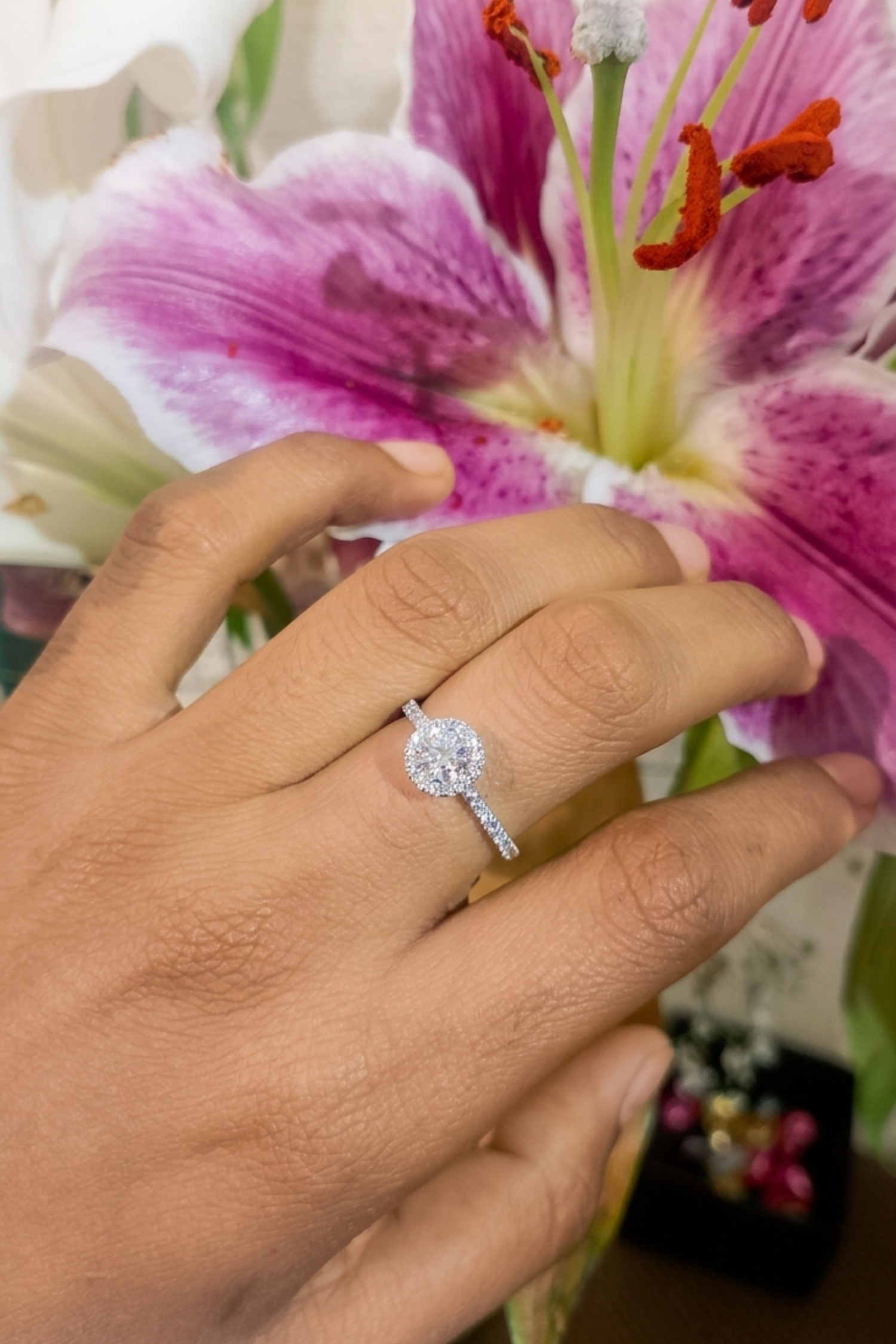 0.30Ct Angelica Halo with a Round Brilliant Solitaire on a Pavé Band in ring Size 10
